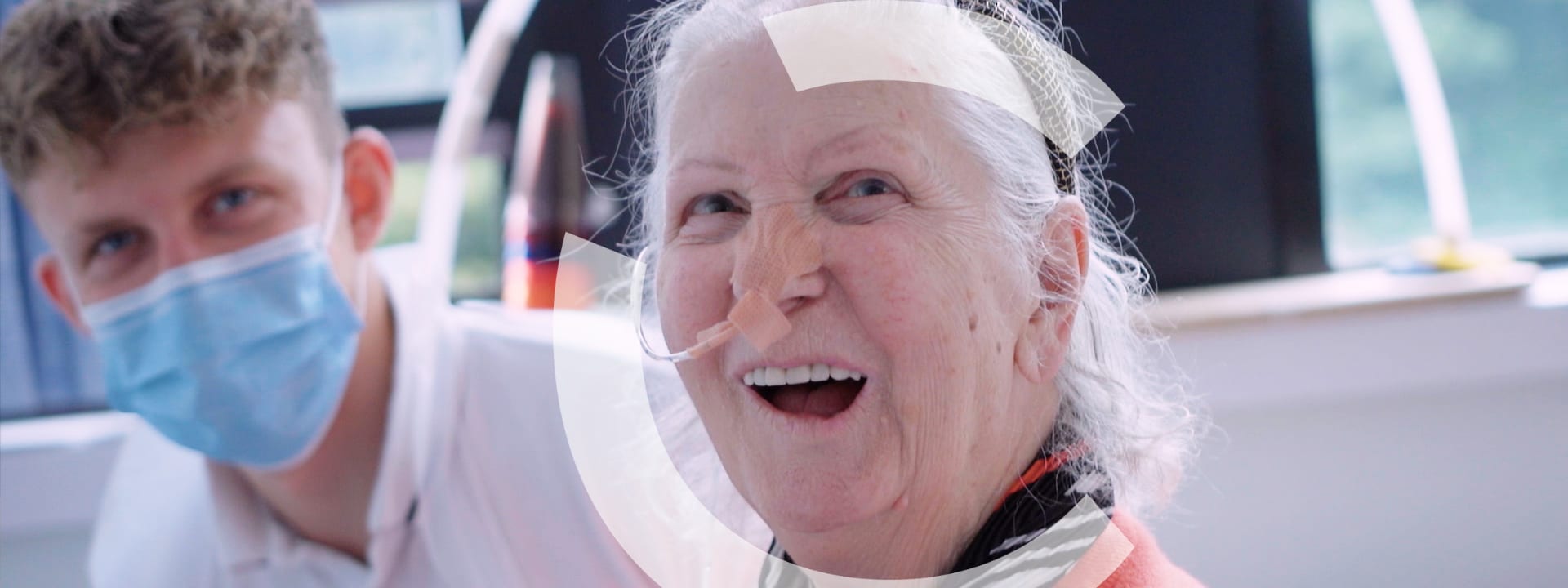 A patient with a feeding tube smiling
